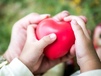 Close-up of hands holding heart shape