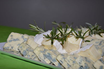Zoom on some cheese decorated with rosemary