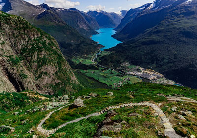 Scenic view on beautiful fjord, town and norwegian mountains