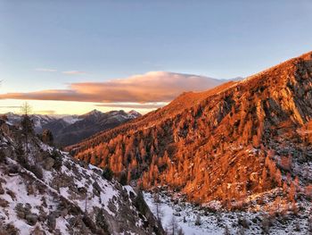 Scenic view of mountains against sky during sunset