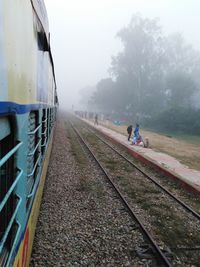 Train on railroad track against sky