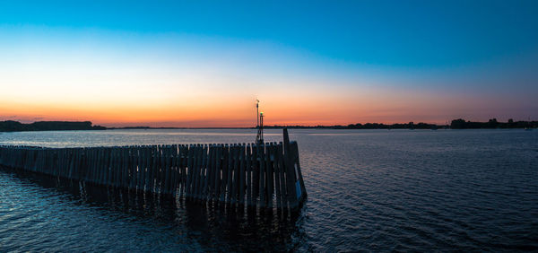 Scenic view of sea at sunset