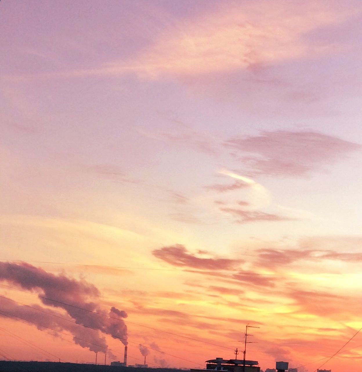 sunset, sky, orange color, beauty in nature, silhouette, scenics, tranquility, cloud - sky, tranquil scene, low angle view, nature, dramatic sky, idyllic, cloud, cloudy, outdoors, no people, landscape, weather, majestic