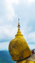 Kyaiktiyo pagoda against cloudy sky