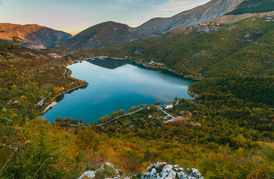 Scenic view of lake and mountains against sky