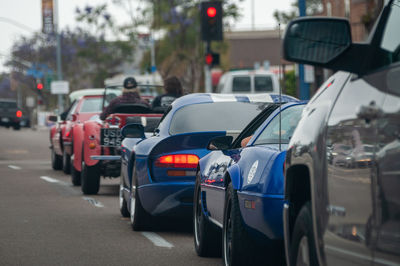 Classic cars driving down the street