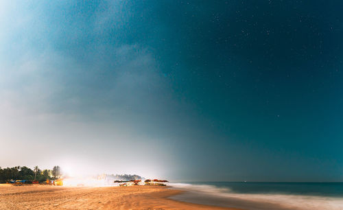 Scenic view of sea against sky at night