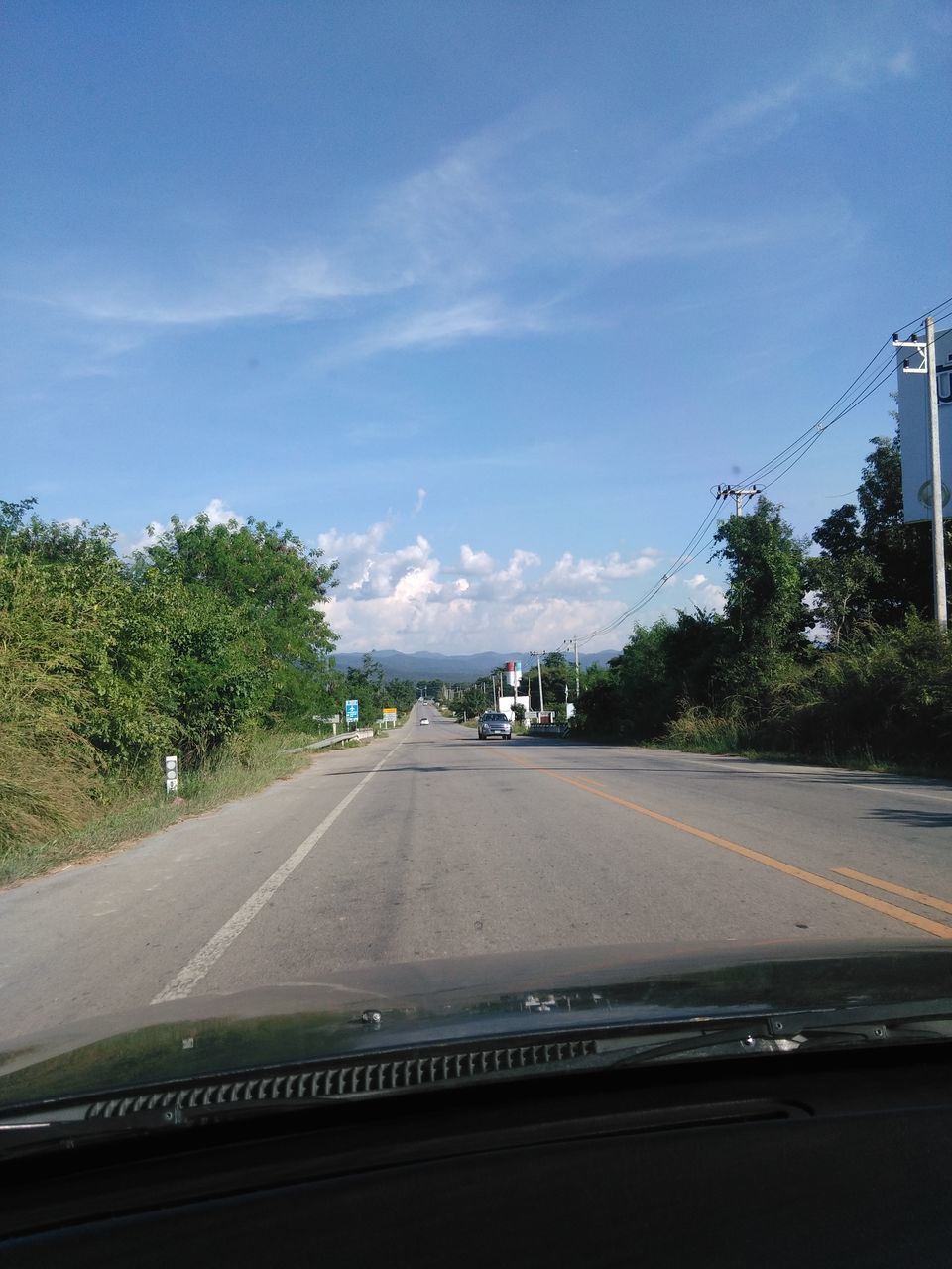 VIEW OF STREET AGAINST SKY