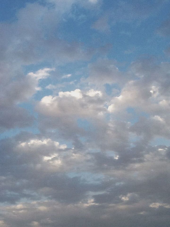 sky, cloud - sky, beauty in nature, cloudy, scenics, tranquility, low angle view, tranquil scene, cloudscape, sky only, nature, cloud, weather, idyllic, backgrounds, blue, outdoors, no people, overcast, full frame