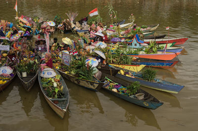 Boats moored in lake