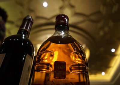 Close-up of wine bottles on table