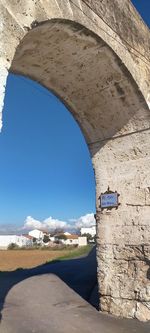 Scenic view of land against blue sky