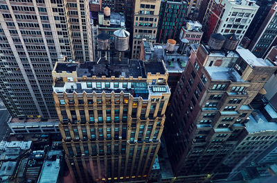 High angle view of modern buildings in city of manhattan