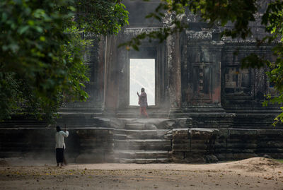 People sweeping in temple