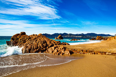 Scenic view of beach against sky