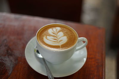 Close-up of cappuccino on table