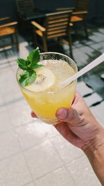 Close-up of hand holding drink