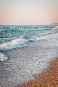 Scenic view of sea against clear sky during sunset