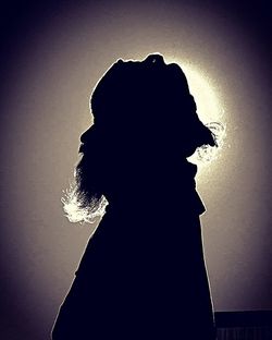 Silhouette of woman in dark background