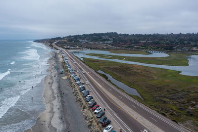 Cars parked along popular torrey pines state beach in california. drone view.