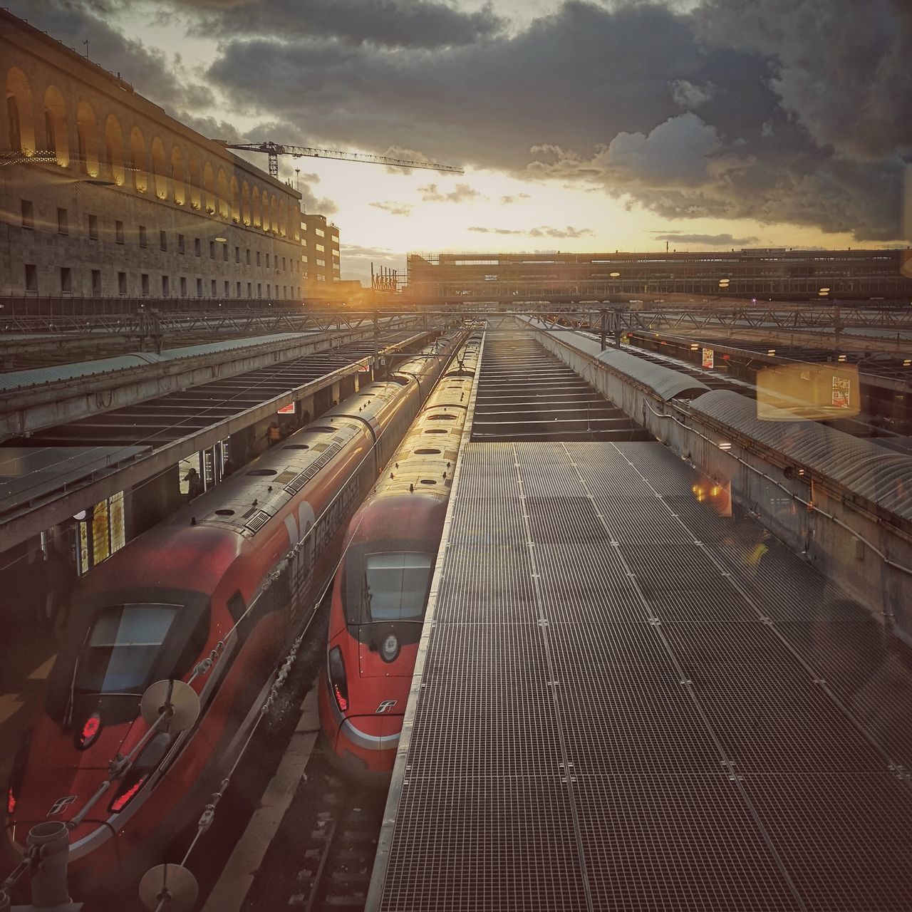 HIGH ANGLE VIEW OF RAILROAD TRACKS AGAINST SKY