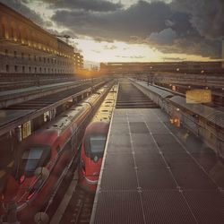 High angle view of railroad tracks against sky during sunset