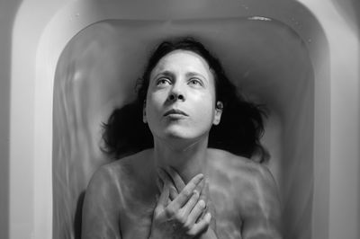 Symbolic portrait of woman in bath 