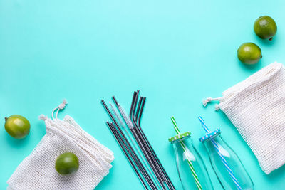 High angle view of fruits on table against blue background
