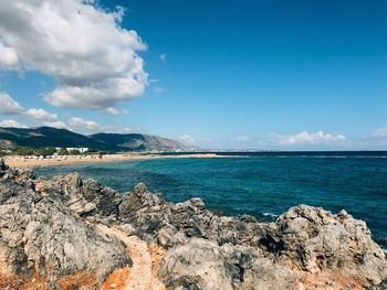 Scenic view of sea against blue sky