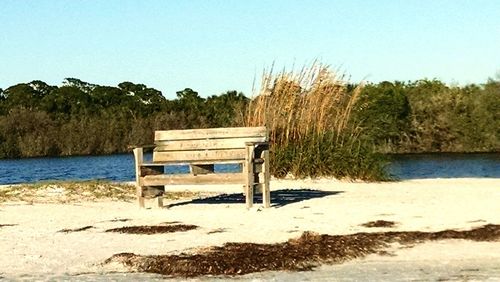 Lifeguard hut on beach against clear sky