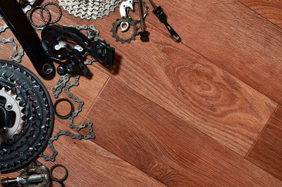 Directly above shot of bicycle chain and gears on table