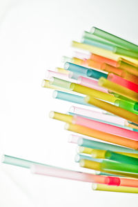 Close-up of colored pencils on white table