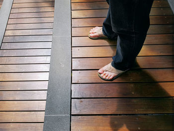 Low section of man standing on floor