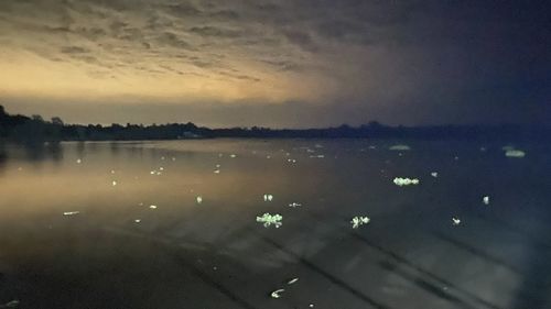 High angle view of sea against sky at sunset