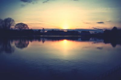 Scenic view of lake at sunset