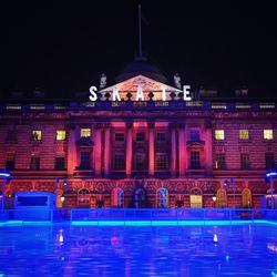 Reflection of illuminated buildings in water at night