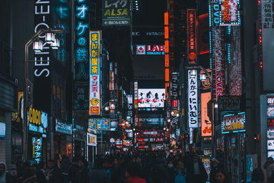 Crowd on city street at night