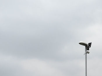 Low angle view of street light against sky