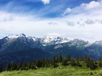 Scenic view of snowcapped mountains against sky