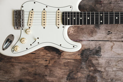 High angle view of guitar on table