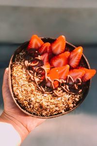 Cropped hand having breakfast 