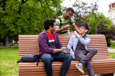 People sitting on bench in park