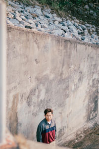 High angle view of man standing by wall