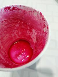 Close-up of pink strawberry on table