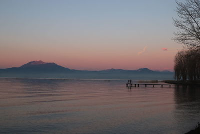 Scenic view of sea against clear sky during sunset