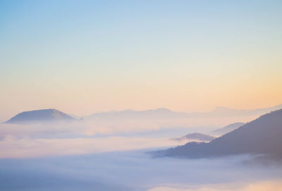 Scenic view of mountains against sky during sunset