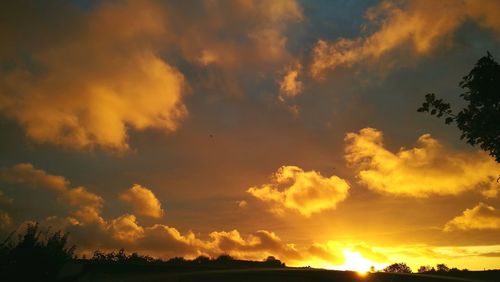 Low angle view of dramatic sky during sunset