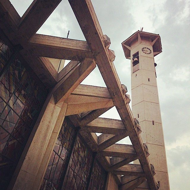 architecture, built structure, low angle view, sky, metal, connection, engineering, building exterior, metallic, bridge - man made structure, cloud - sky, history, day, no people, architectural feature, outdoors, old, tower, travel destinations, cloud