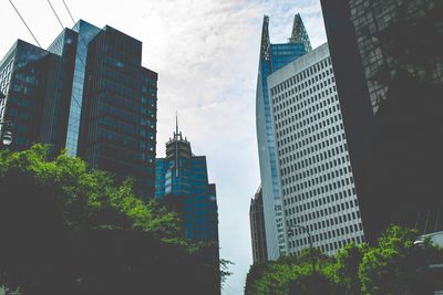 Low angle view of skyscrapers against sky