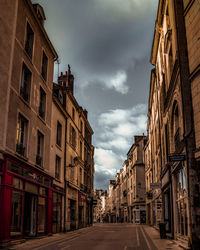 Street amidst buildings against sky